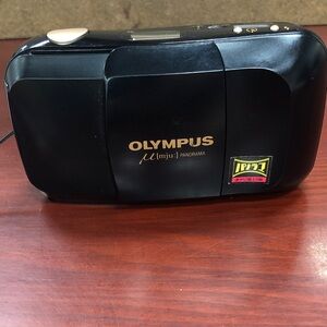 Olympus Maui Panorama compact film camera which features a 35mm f/3.5 lens